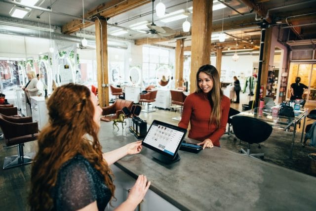 two women near tables app development small business